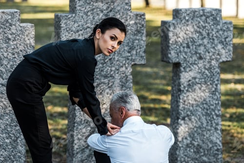 Preview: attractive woman looking at camera near sad man in graveyard