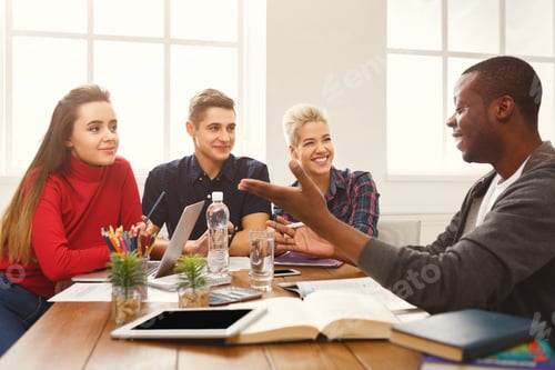 Preview: Multiethnic University Students Studying Together. Young People Working With Tests And Gadgets At