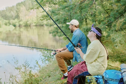 Preview: Young Adult Man and Girl with Down Syndrome Fishing Together by Lake