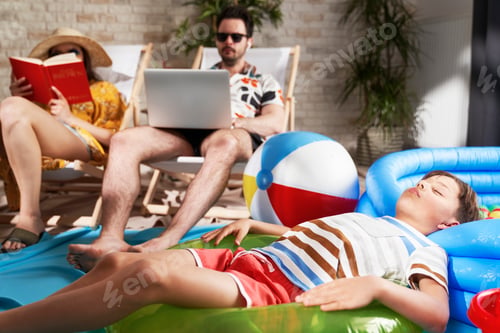Preview: Family relaxes while on vacation at home during a pandemic