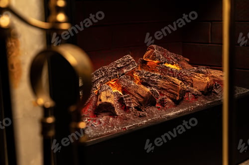 Preview: Close up of a fireplace with burning wood logs inside