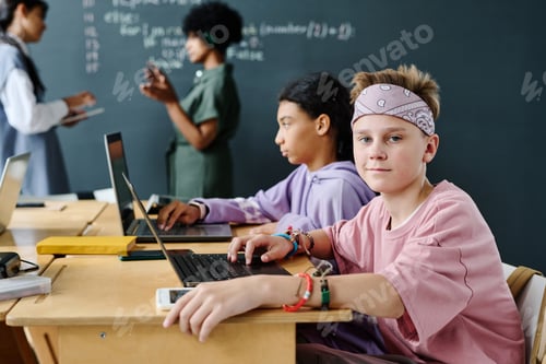 Preview: Students working online on laptop at class