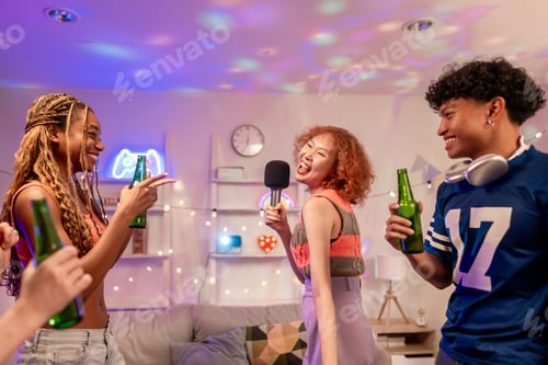 Preview: Group of diverse Generation Z friends enjoying a party in a cozy house.