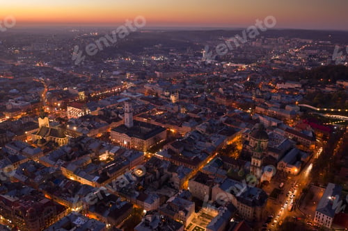 Preview: Aerial View of Lviv City at Twilight with Illuminated Streets, Ukraine