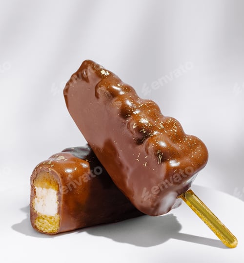 Preview: Chocolate covered ice cream bars resting on a clean background