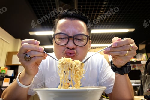 Preview: man eating Instant noodles