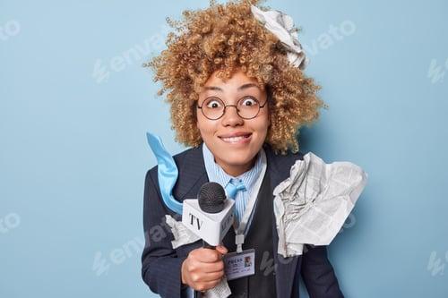Preview: Photo of surprised curious woman bites lips stares with curious expression at camera reports recent