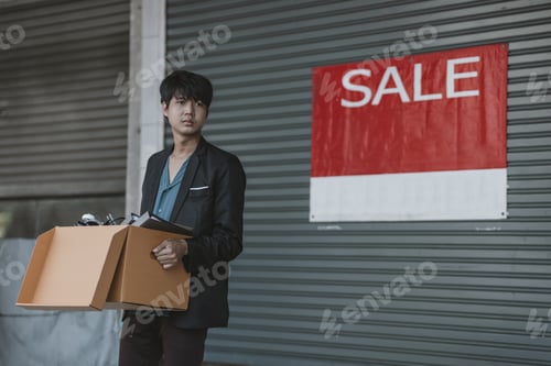 Preview: Businessman fired the company are carrying boxes down the street looking for a new job.