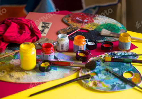 Preview: Colorful paining tools, palettes, paintbrushes on the table