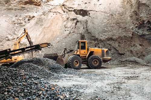 Preview: Industrial machinery on ore quarry site, heavy duty excavator moving gravel and rocks.