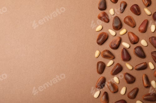 Preview: Flat lay composition with pine nuts and space for text on color background