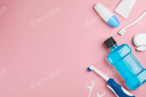 Preview: Flat lay composition with oral care products and space for text on color background. Teeth hygiene