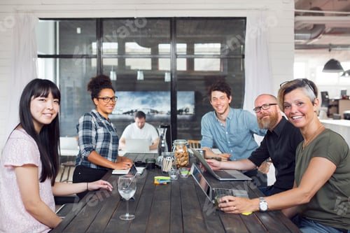 Preview: Coworkers sharing ideas in a modern office space