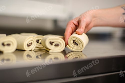 Preview: Closeup of hands making dessert in a bakery