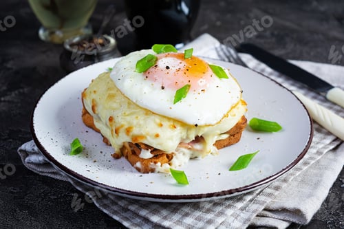 Preview: Delicious breakfast. Hot french toast with ham and bechamel sauce - croque madame