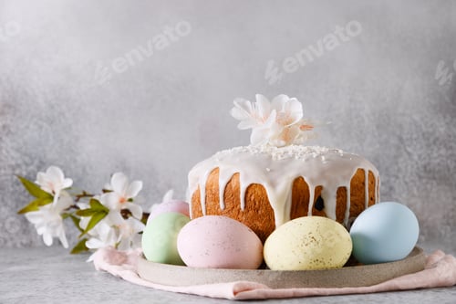 Preview: Easter cake decorated eggs and spring blossom flowers.