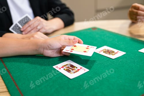 Preview: A woman is playing a card game with a man
