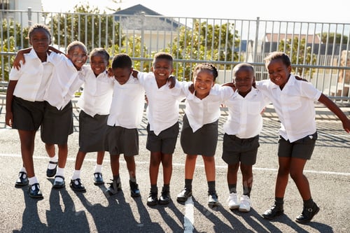 Preview: Elementary school kids in Africa posing in school playground