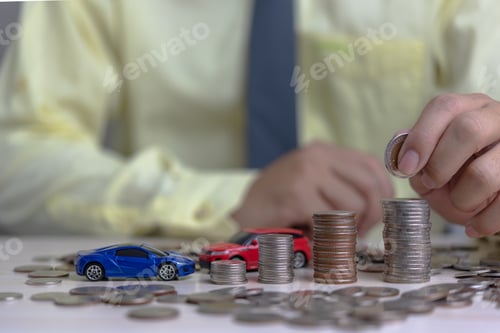 Preview: saving money hand holding coin stack and car insurance business currency investment