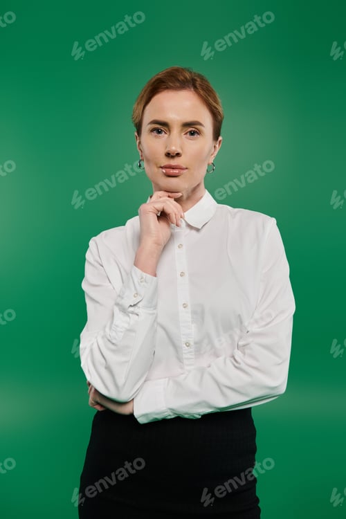 Preview: Elegant woman in formal attire poses thoughtfully against a vibrant green backdrop