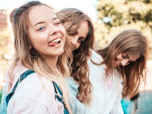 Preview: Portrait of three young beautiful women posing outdoors
