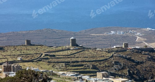 Preview: Old stonewall windmill, Tinos island Cyclades Greece. Aegean blue sea. Summer holiday destination
