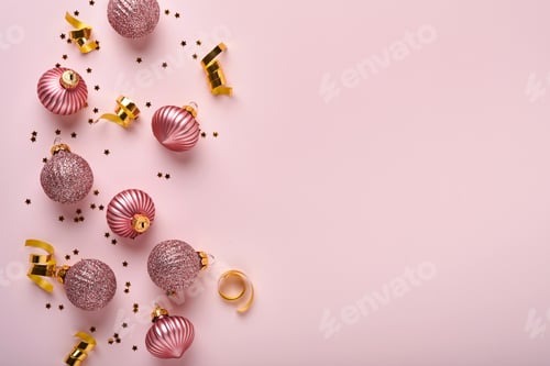 Preview: Christmas composition. Christmas pink gift or present box, gold baubles and confetti on pink backgro
