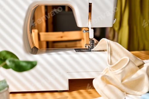 Preview: Sewing machine with linen cloth. Industry, fashion concept. Slow fashion.