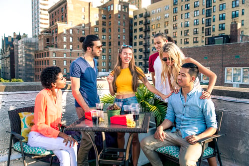 Preview: Group of friends having party on a rooftop