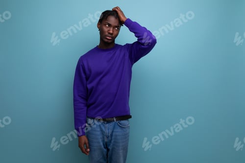 Preview: portrait inspired by the idea of a dark-skinned american young guy in a blue sweatshirt and jeans in
