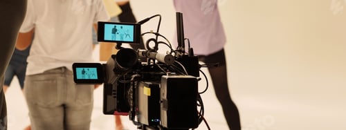 Preview: Film director and crew making commercial content advertising in studio.