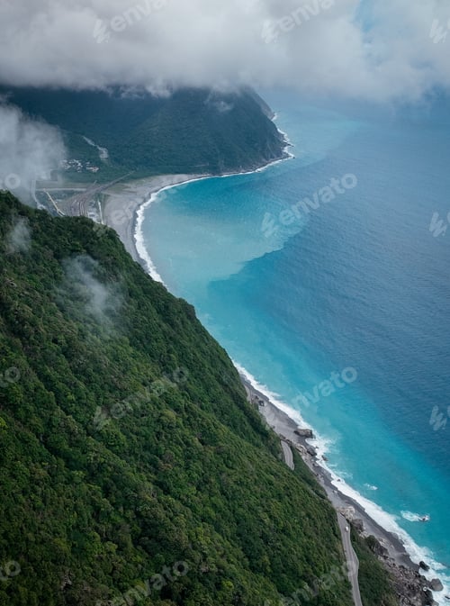 Preview: Aerial view of Taiwan stunning coastline with lush greenery and turquoise blue waters