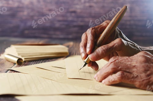 Preview: senior women hand writing letter with a fountain pen