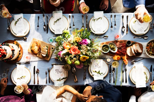 Preview: Groom kissing bride hand in wedding reception aerial view