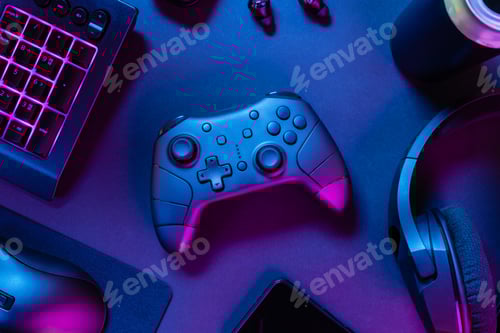 Preview: Game controller with purple lit keyboard amidst various wireless devices