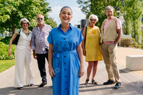 Preview: Group of senior friends meeting outddors in the city and having fun
