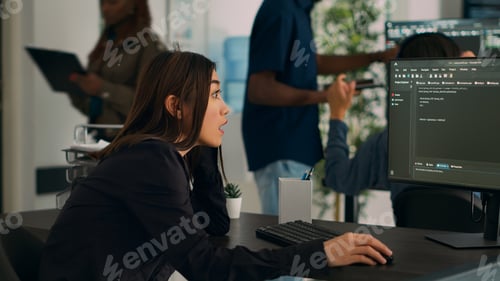 Preview: Asian developer coding html script information on computer at desk