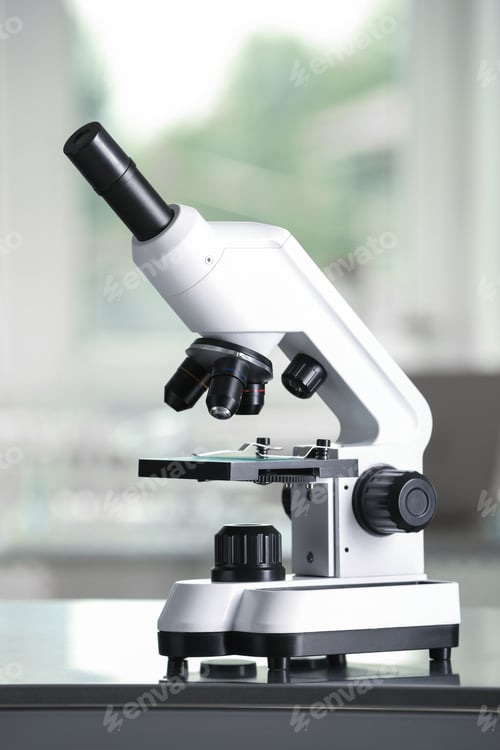 Preview: Modern medical microscope on metal table in laboratory