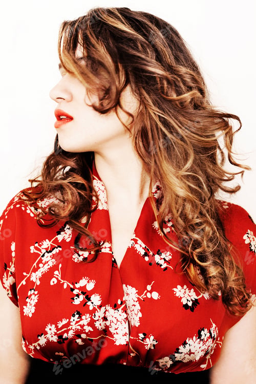 Preview: Portrait of a young woman shaking hair