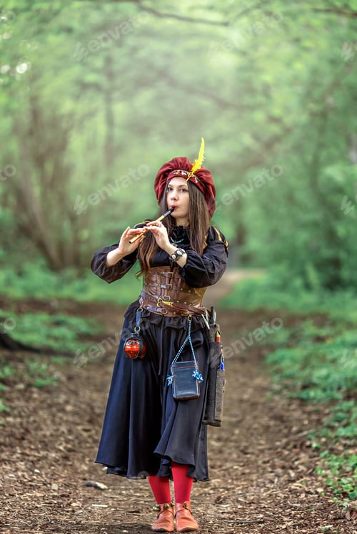 Preview: A woman with a flute. A girl in a burgundy beret with feathers plays a pipe.Fantasy.Medieval dress