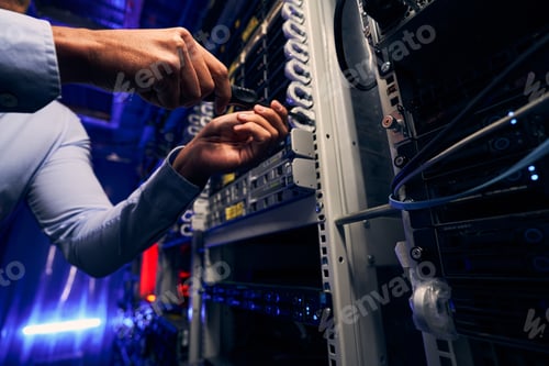 Preview: Experienced IT technician installing new network equipment