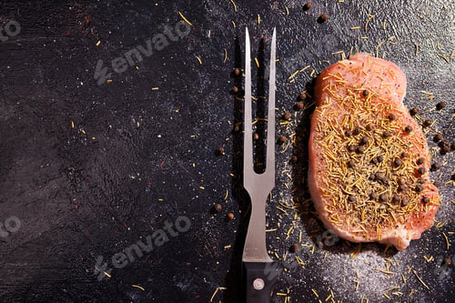 Preview: Top view on piece of raw steak meat seasoned with pepper, salt a