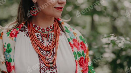 Preview: Pretty woman in traditional ukrainian jewelry necklace, dress, handkerchief and gerdan.