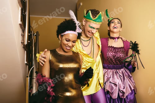 Preview: Group of cheerful people having fun while going to Mardi Gras carnival.