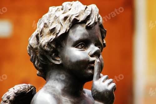Preview: Cupid sitting on stone.