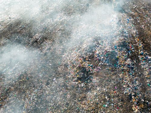 Preview: Aerial view of burning trash piles in landfill
