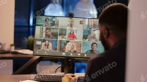Preview: Office employee talking to people on online business videocall