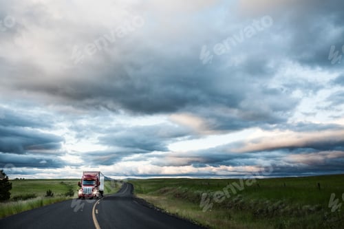 Preview: truck on a highway through the grasslands area of eastern Washington, USA.
