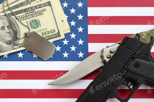 Preview: Close up dollar money with weapons and military badges on United States flag