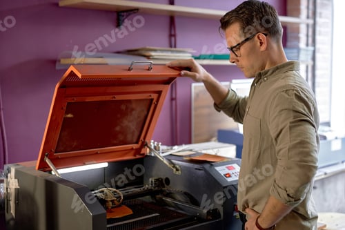 Preview: creative craftsman makes an embossed pattern on a leather surface